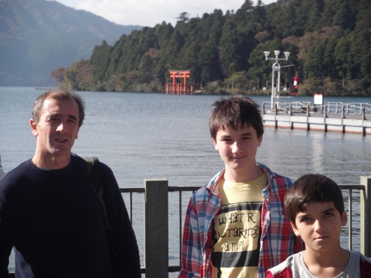 Lake Ashi with torii in the background and Mt Fuji in the clouds